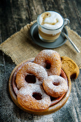 Donuts sprinkled with powdered sugar. Russian cuisine