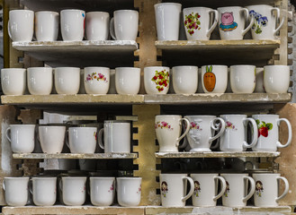 Ceramic mugs on racks