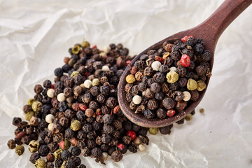 Shichimi pepper in Wooden spoon on crumpled paper background,Blend of spices
