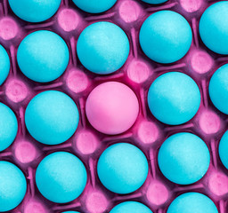 Pink egg in many blue eggs,visual art pattern