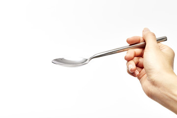 woman's right hand holds a spoon