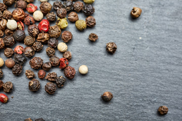 mixture of pepper peas powder scattered on a slate plate
