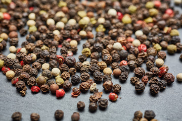 mixture of pepper peas powder scattered on a slate plate