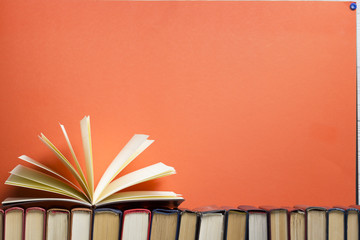 Open book, hardback books on wooden table. Back to school. Copy space