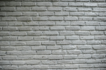 The background is beautiful. An empty city backdrop with brick walls laid against each other.