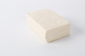 Raw tofu on white background.