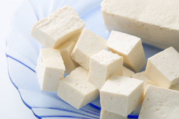 Closeup of Tofu and Soybeans. Soybeans and tofu are a good source of protein and a serious food allergen.