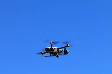Drone with four propellers in flight