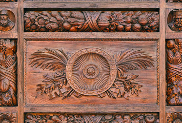 Detail of a carved pattern on the wooden door of the Basilica di Santa Croce (Basilica of the Holy Cross) in Florence, Italy