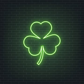 Saint Patrick's Day. Neon glowing sign of three leaves clover leaf. Saint Patrick neon set