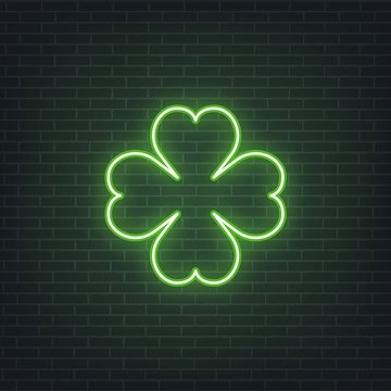 Saint Patrick's Day. Neon glowing sign of four leaves clover leaf. Saint Patrick neon set