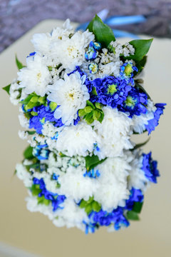 Wedding bouquet white blue chrysanthemum flower, hyacinth flower. Delicate white blue chrysanthemum wedding bouquet. Beautiful wedding bride bouquet white blue chrysanthemum flower nuptial september