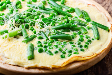 Egg omelette filling with grated cheese and green vegetables