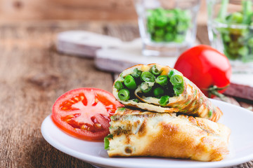 Egg omelet roll with  green beans and peas filling