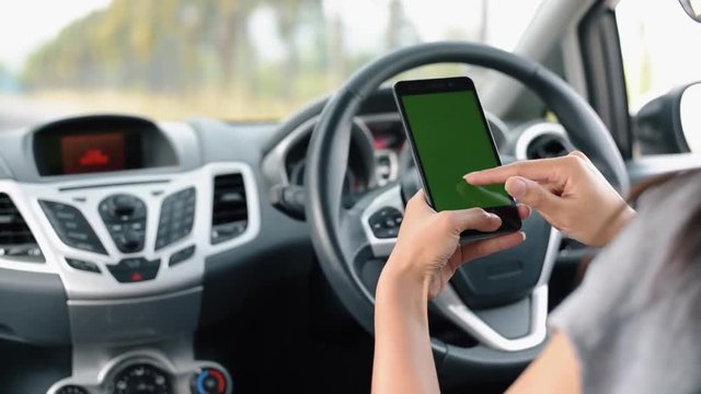 Chroma Key : Woman using a smart phone on car.