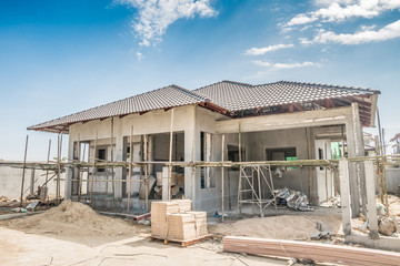 Fototapeta premium construction residential new house in progress at building site