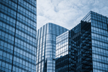 Modern office building against blue sky.