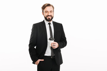 Cheerful young businessman standing isolated