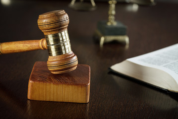 Law and Justice concept. Brown wooden background