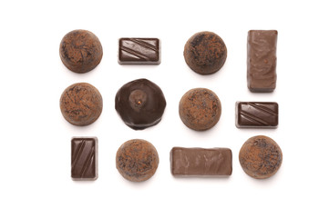 Assorted chocolate candies on white