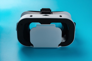 front view VR Glasses or Virtual Reality headset on a blue background
