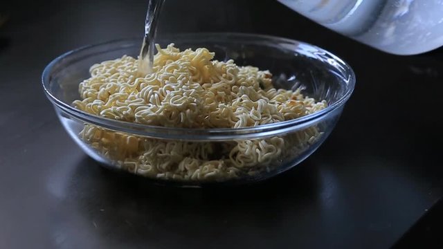 bearded man eating instant noodles