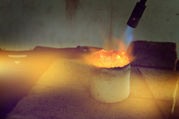 melting silver in craft jewelry making, handmade silverware process.