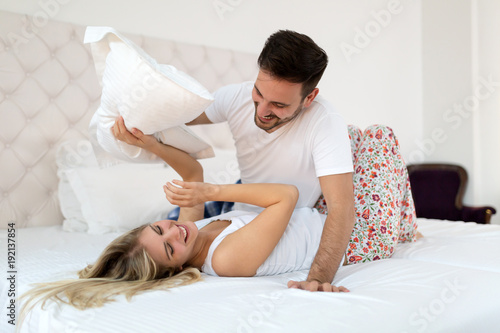 Young Couple Having Having Romantic Times In Bedroom