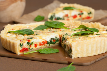 Fototapeta na wymiar Home Baked Quiche With Spinach, Bell Pepper, Feta Cheese.