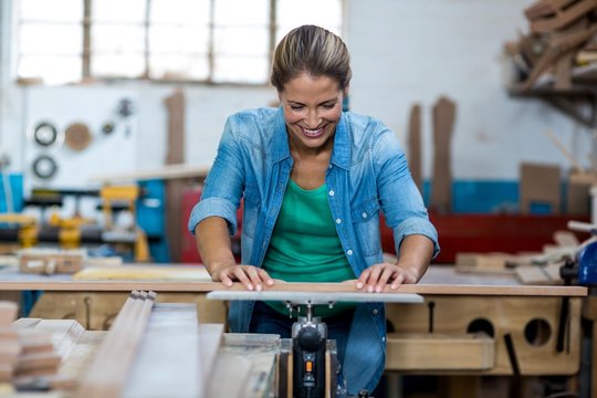 Female carpenter working in workshop