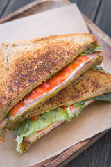 Toasted sandwiches with bacon and tomato