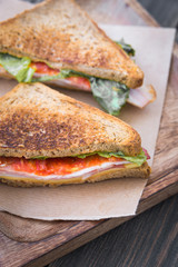 Rustic sandwiches with cheese, tomato and bacon