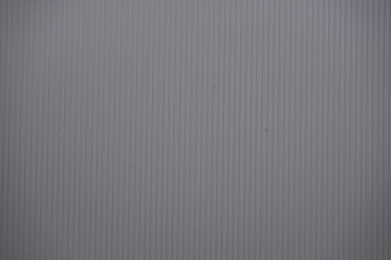 Obraz premium Grey colored corrugated cardboard texture useful as a background