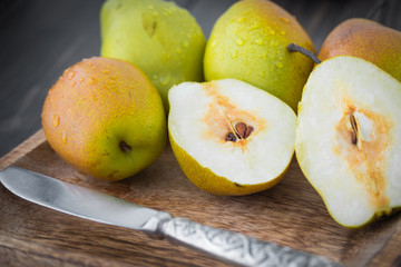 Sliced sweet pears with a silver knife