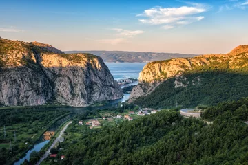 Fototapeten Panoramic view of the canyon and estuary (mouth) of Cetina river, town of Omis and island Brac in Adriatic sea through the rocky Dinara mountains, Croatia © larauhryn