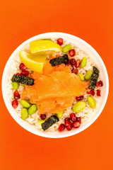 Food Bowl Of Smoked Salmon With Rice Edamame beans Seaweed and Pomegranate Seeds