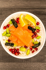 Food Bowl Of Smoked Salmon With Rice Edamame beans Seaweed and Pomegranate Seeds