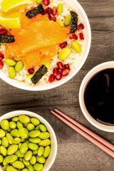 Food Bowl Of Smoked Salmon With Rice Edamame beans Seaweed and Pomegranate Seeds