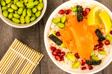 Food Bowl Of Smoked Salmon With Rice Edamame beans Seaweed and Pomegranate Seeds