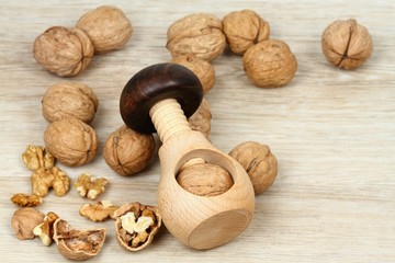 Wooden nutcracker in mushroom  shape  & walnuts