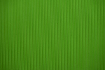 Obraz premium Light green colored corrugated cardboard texture useful as a background
