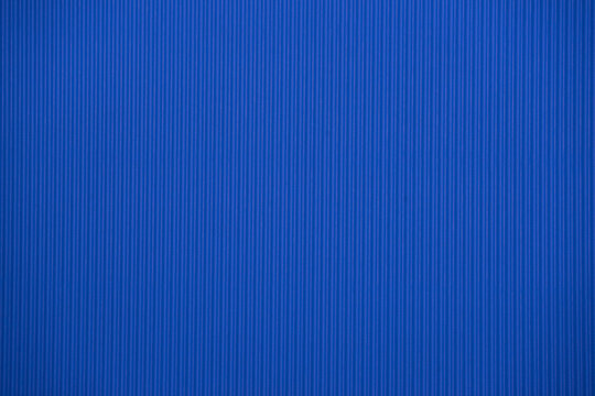 Dark blue colored corrugated cardboard texture useful as a background