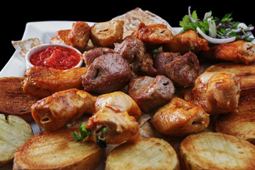 Assorted meat with baked potatoes