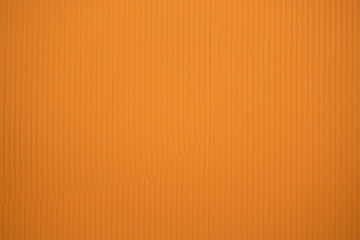 Orange colored corrugated cardboard texture useful as a background