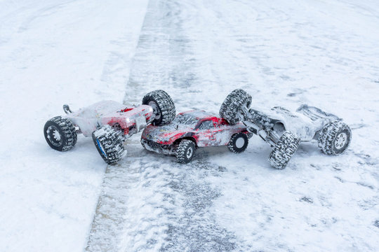 Fototapeta Three toy sports cars on winter rally