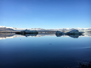 Fototapeta na wymiar Two icebergs floating in Jokulsarlon Lake in Iceland