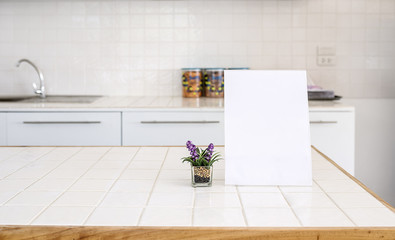 Mock up Blank Menu frame and houseplant whit copy space on Table in Kitchen room