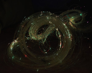 Abstract background. Luminous swirling. Elegant glowing. Sparking particle.  Glint lines.