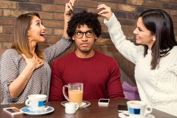 Group of friends at a cafe having fun