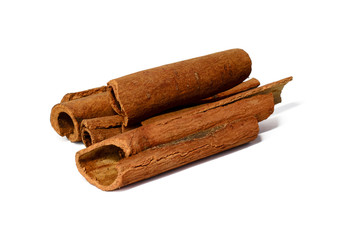 Whole cinnamon in sticks isolated on white background. Fragrant spices